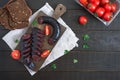Morsilla - blood sausage. Pieces of Spanish black pudding on a wooden cutting board. Easter menu. The top view Royalty Free Stock Photo