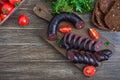 Morsilla - blood sausage. Pieces of Spanish black pudding on a wooden cutting board. Easter menu. The top view Royalty Free Stock Photo