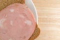 Mortadella sandwich on wheat bread top close view