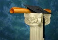Mortar board and diploma on pedestal - blue Royalty Free Stock Photo