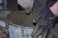 Cement mortar in a bucket is mixed in the photo. Royalty Free Stock Photo