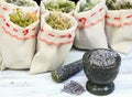 Mortar with lavender and dried medicinal and culinary herbs Royalty Free Stock Photo