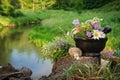 Mortar of medicinal herbs, bunch of healing plants on a wooden stump on bank of forest river outdoors