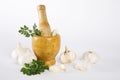 Mortar and pestle with garlic and parsley
