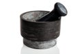 Mortar with a pestle for grinding and crushing spices, peppers and herbs, heavy stone, isolated on a white Royalty Free Stock Photo