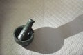 mortar and pestle on textured surface Royalty Free Stock Photo