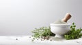 a mortar and pestle with various herbs and spices on a marble countertop Royalty Free Stock Photo