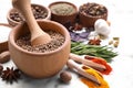 Mortar and spices on white marble table, closeup Royalty Free Stock Photo