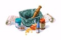 Mortar surrounded by drugs, medicines and prescriptions. Royalty Free Stock Photo