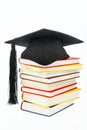 Mortarboard on a book stack Royalty Free Stock Photo