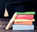 A mortarboard and graduation scroll Royalty Free Stock Photo