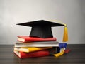 Mortarboard standing on book stack. Generative AI Royalty Free Stock Photo