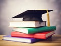 Mortarboard standing on book stack. Generative AI Royalty Free Stock Photo