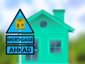 mortgage ahead sigh board in blur home background