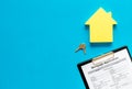 Mortgage application with house figure and keys on blue background top view mock up