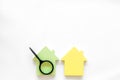 Mortgage credit concept with house toy and magnifier on white background top view copy space Royalty Free Stock Photo