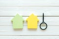 Mortgage credit concept with house toy and magnifier on white wooden background top view space for text Royalty Free Stock Photo