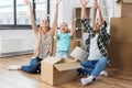 Happy family playing with foam peanuts at new home Royalty Free Stock Photo