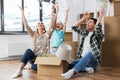 Happy family playing with foam peanuts at new home Royalty Free Stock Photo