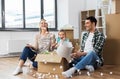 Happy family playing with foam peanuts at new home Royalty Free Stock Photo