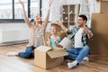 Happy family playing with foam peanuts at new home Royalty Free Stock Photo