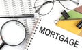 MORTGAGE - the inscription of text on the Notepad, and chart. Business concept Royalty Free Stock Photo