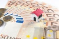 Mortgage and loan concept: paper house on a fifty euros banknote Royalty Free Stock Photo