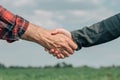 Mortgage loan officer and farmer shaking hands upon reaching an agreement Royalty Free Stock Photo