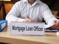 Mortgage Loan Officer is shown on the photo using the text Royalty Free Stock Photo
