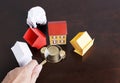 Mortgage loans concept with paper house and coins stack