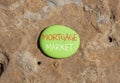 Mortgage market symbol. Concept words Mortgage market on beautiful green stone. Beautiful red stone background. Business mortgage