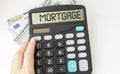 Mortgage pre-approval, calculator with pre-approval text in hands