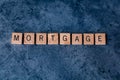 `Mortgage` spelled out in wooden letter tiles