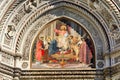 Christ enthroned with the Mother of God and Saint John the Baptist. Cathedral of Santa Maria del Fiore. Facade. Florence. Italy. Royalty Free Stock Photo