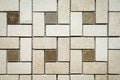 Mosaic of beige and brown marble in the form of squares and rectangles.