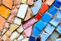 Mosaic of broken multicolored small tiles tiles as background