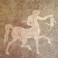 Mosaic of a Centaur holding a rabbit
