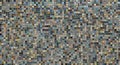 Mosaic composed of small, square tiles in a vast array of colors, including blues,