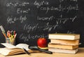 Mosaic of Educational Tools and Symbols in a Study Space With Math Formulas on a Chalkboard Royalty Free Stock Photo