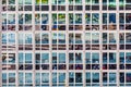 Facade of office building with reflection of street life