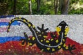 Mosaic with a fire salamander or salamandra figure made of waste plastic caps
