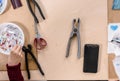 Different devices for making mosaic on table in modern studio