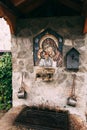 Mosaic icon of the Mother of God and Child on the stone wall of the temple