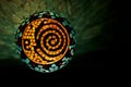 Mosaic lighted ball with sun, moon and spiral design in horizontal position