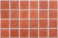 Mosaic made of red ceramic tiles in form of squares in rectangular form