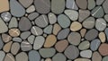Natural river-pebble mosaic pattern with smooth rounded stones in cool earthy tones Royalty Free Stock Photo