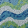 A mosaic pattern featuring small, irregularly shaped tiles in shades of blue, green, and Royalty Free Stock Photo