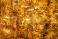 Mosaic of polished amber plates in contour sunlight as background, close up