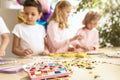 Mosaic puzzle art for kids, children`s creative game. two sisters are playing mosaic Royalty Free Stock Photo