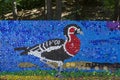 Mosaic with a red breasted goose or branta ruficollis figure made of waste plastic caps